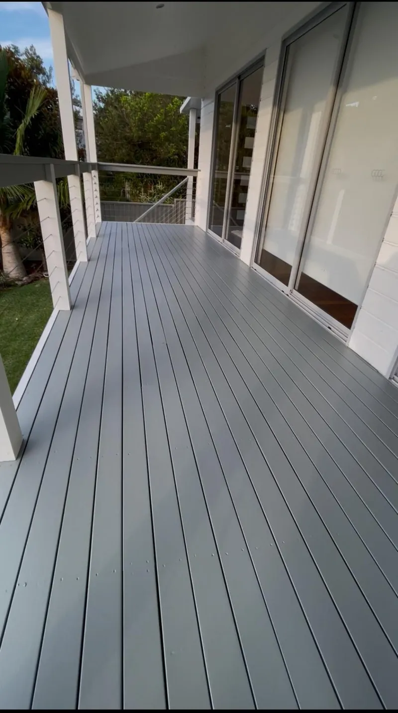 Long timber veranda deck painted in grey