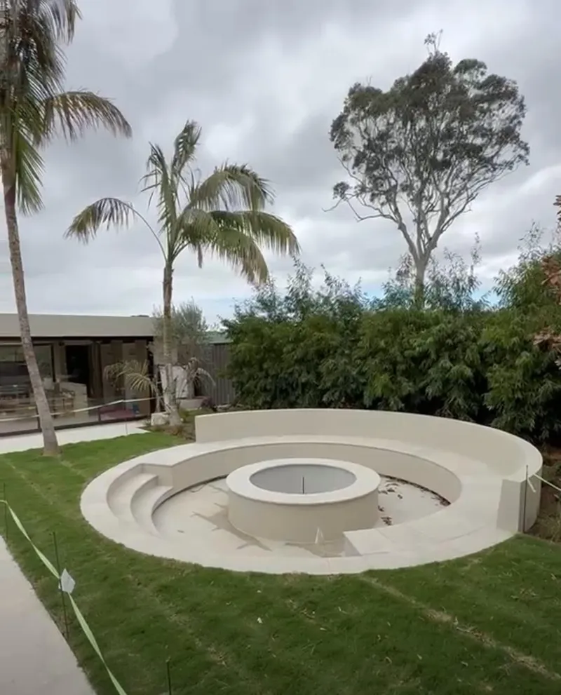 Circular fire pit in the communal garden of a new development