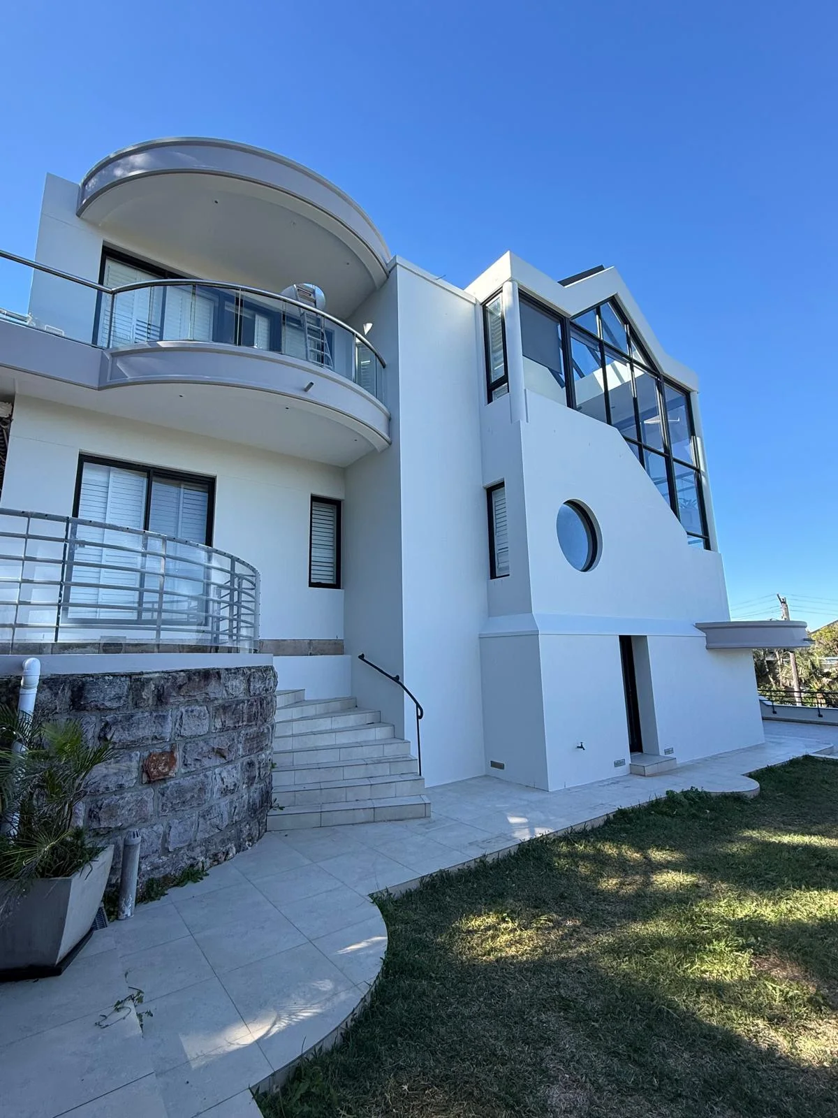 White three-storey home painted by Pae Painting, used to preview wall colours